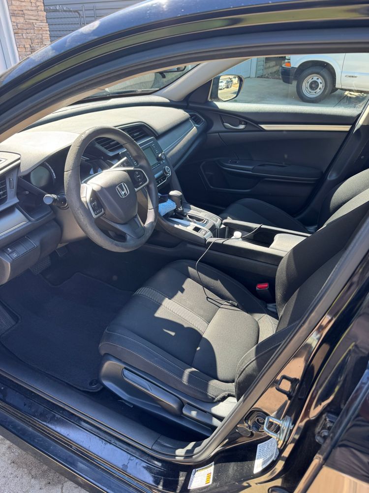 Clean front interior of a Honda sedan