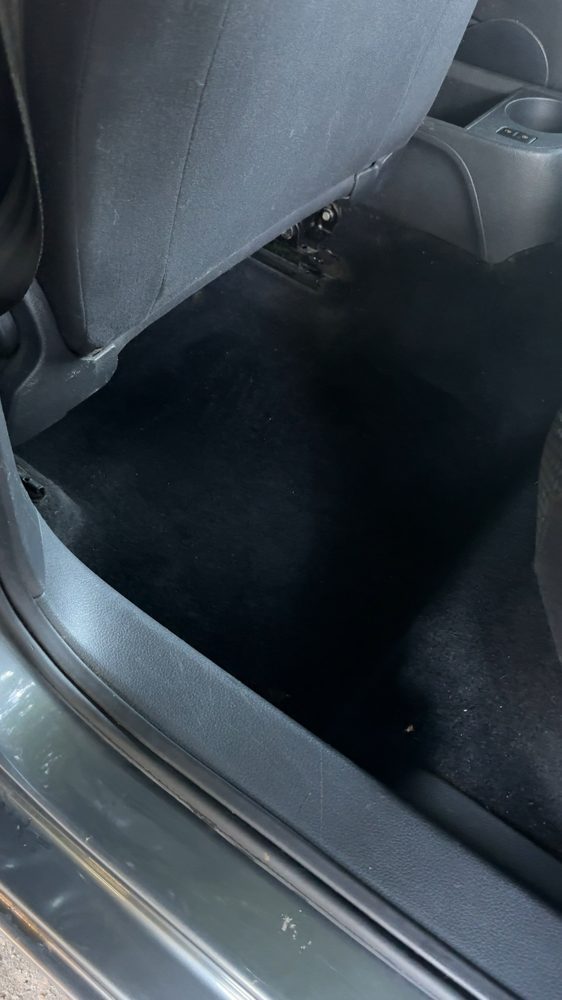 Clean rear floor carpet of a Volkswagen after cleaning